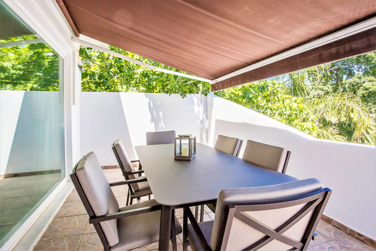 Dining table in the outdoor area of the villa